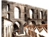 Neapolis, present day Kavalla. The town built on a rocky promontory apparently bridged to the Macedonian mainland by this Roman aqueduct. An early photograph.